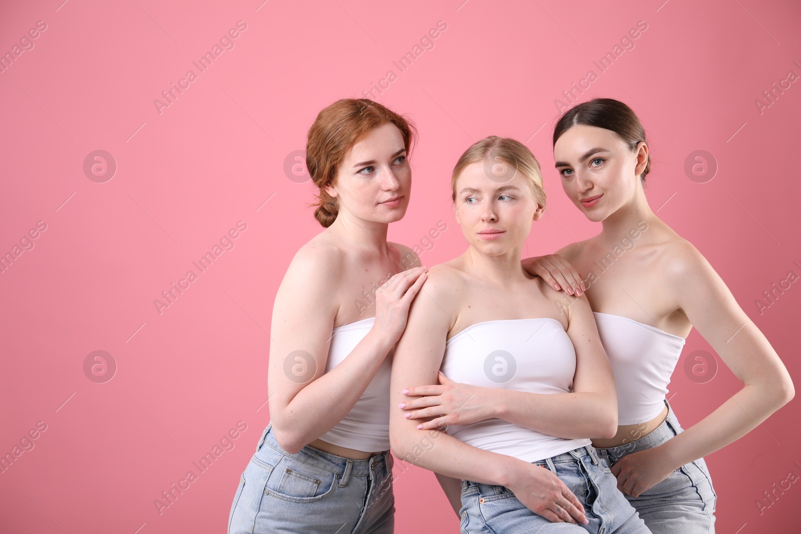 Beautiful women with different hair colors on pink background, space for text Photo of Beautiful women with different hair colors on pink background, space for text