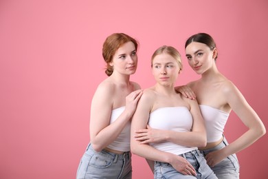Photo of Beautiful women with different hair colors on pink background, space for text