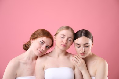 Photo of Beautiful women with different hair colors on pink background