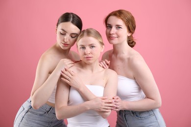 Photo of Beautiful women with different hair colors on pink background