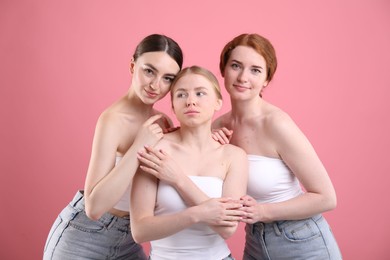 Photo of Beautiful women with different hair colors on pink background