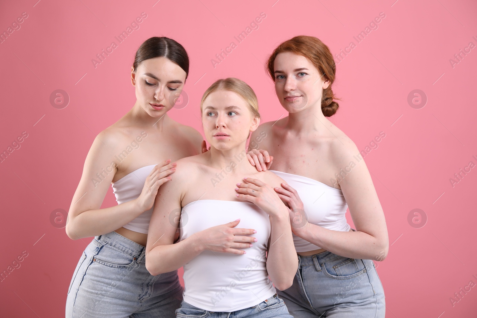 Beautiful women with different hair colors on pink background Photo of Beautiful women with different hair colors on pink background