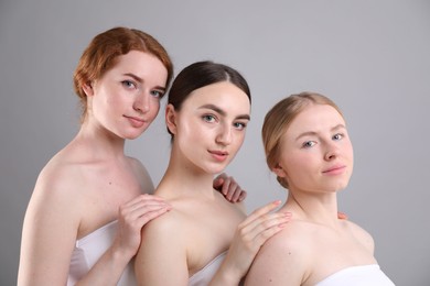 Photo of Beautiful women with different hair colors on grey background