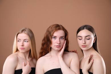 Photo of Beautiful women with different hair colors on dark beige background