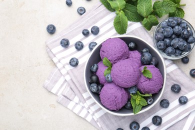 Photo of Tasty sorbet with blueberries and mint on light grey table, flat lay. Space for text