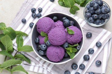 Photo of Tasty sorbet with blueberries and mint on light grey table, flat lay