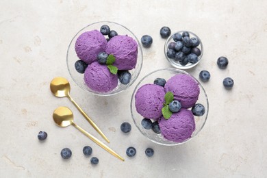 Photo of Tasty sorbet with blueberries and mint on light grey table, flat lay