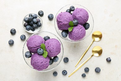 Photo of Tasty sorbet with blueberries and mint on light grey table, flat lay
