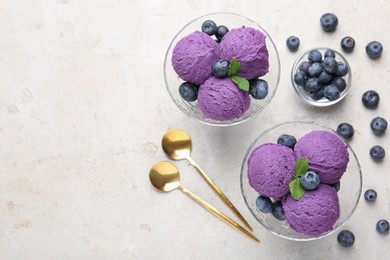 Photo of Tasty sorbet with blueberries and mint on light grey table, flat lay. Space for text