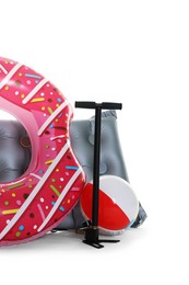 Photo of Inflatable ring, mattress, ball and manual air pump isolated on white