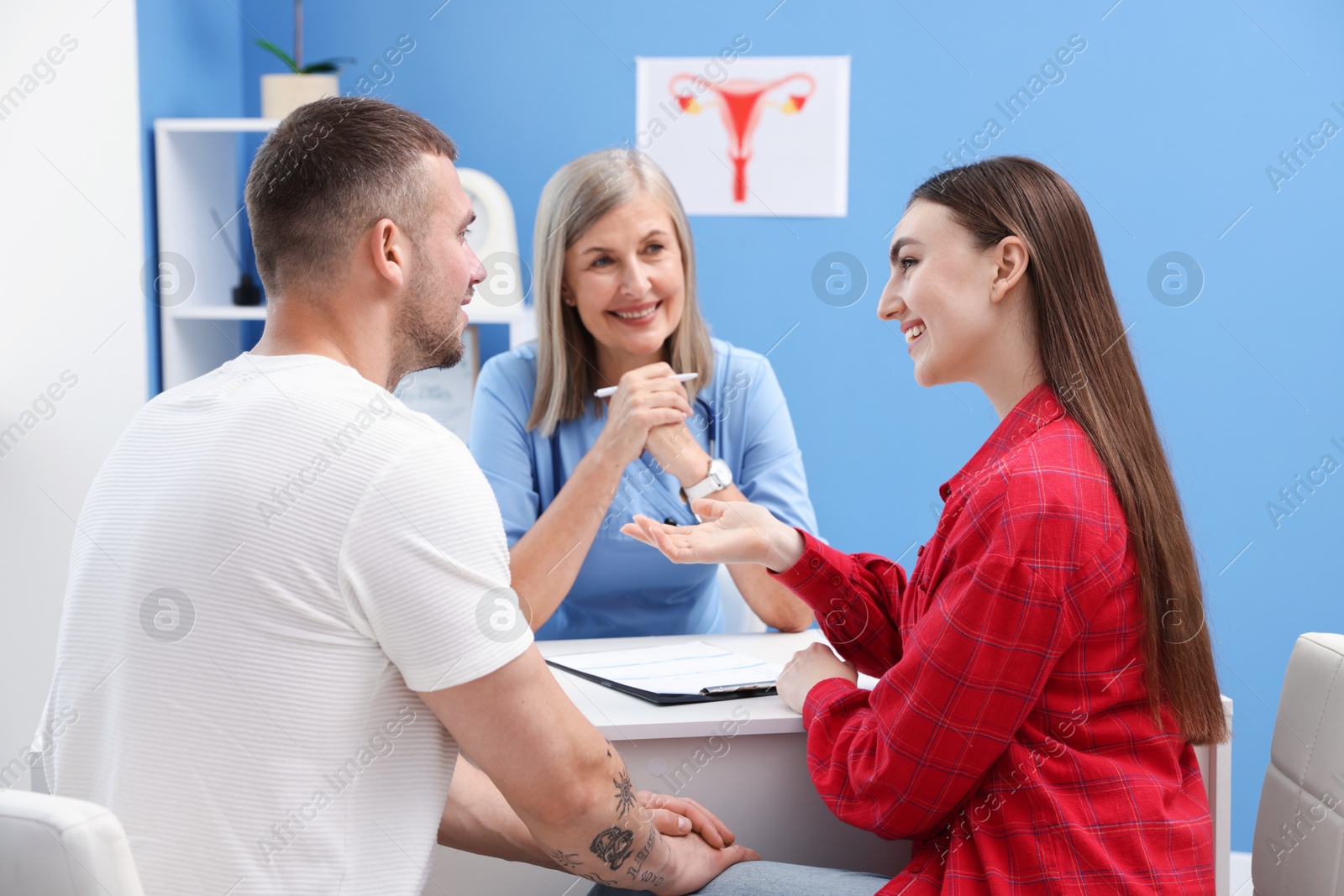 Photo of In vitro fertilization (IVF). Couple having consultation with doctor in reproductive clinic