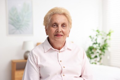 Photo of Portrait of happy senior woman at home