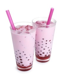 Photo of Tasty milk bubble tea in glasses isolated on white