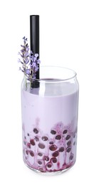 Photo of Tasty milk bubble tea in glass and lavender flowers isolated on white