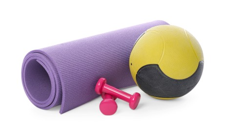 Photo of Medicine ball, dumbbells and fitness mat isolated on white
