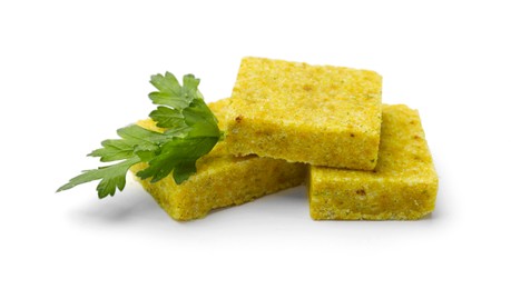 Photo of Tasty aromatic bouillon cubes and parsley isolated on white