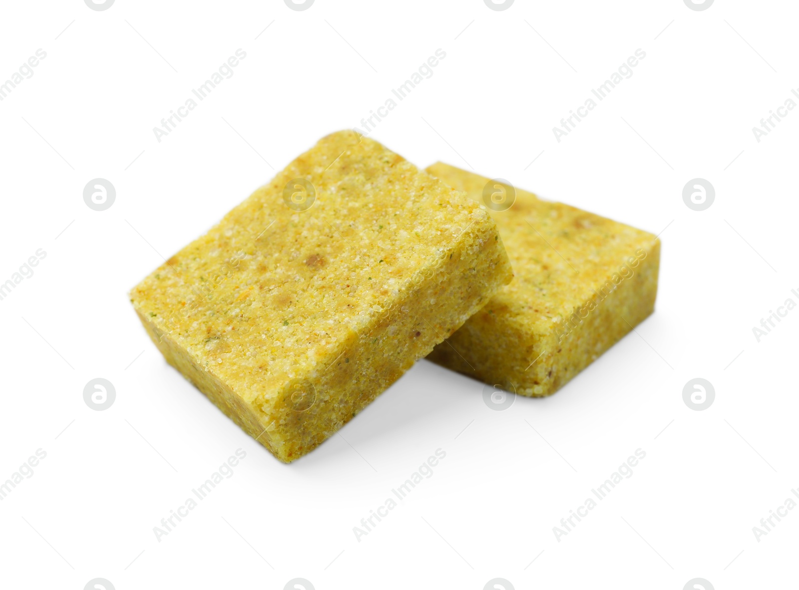 Tasty aromatic bouillon cubes isolated on white Photo of Tasty aromatic bouillon cubes isolated on white