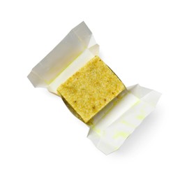 Photo of Tasty aromatic bouillon cube in wrap isolated on white, top view