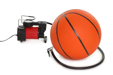 Photo of Basketball ball and air compressor isolated on white