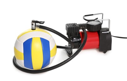 Photo of Volleyball ball and air compressor isolated on white