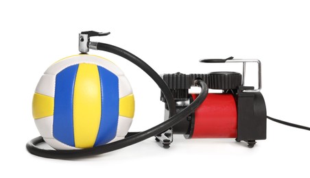 Photo of Volleyball ball and air compressor isolated on white