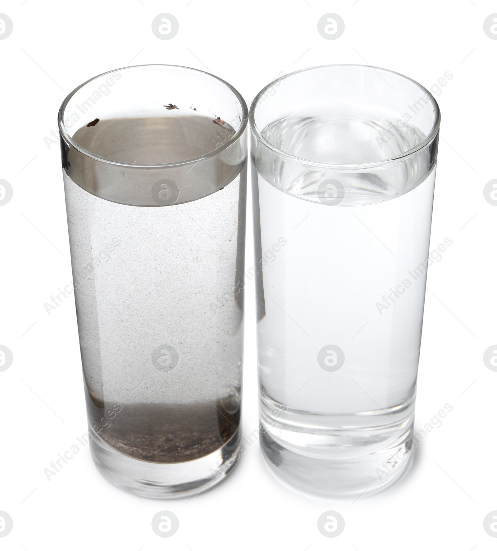 Glasses with clean and dirty water isolated on white Photo of Glasses with clean and dirty water isolated on white