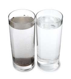 Photo of Glasses with clean and dirty water isolated on white