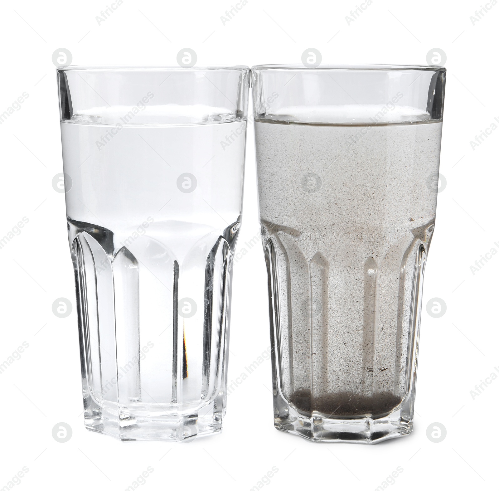 Glasses with clean and dirty water isolated on white Photo of Glasses with clean and dirty water isolated on white