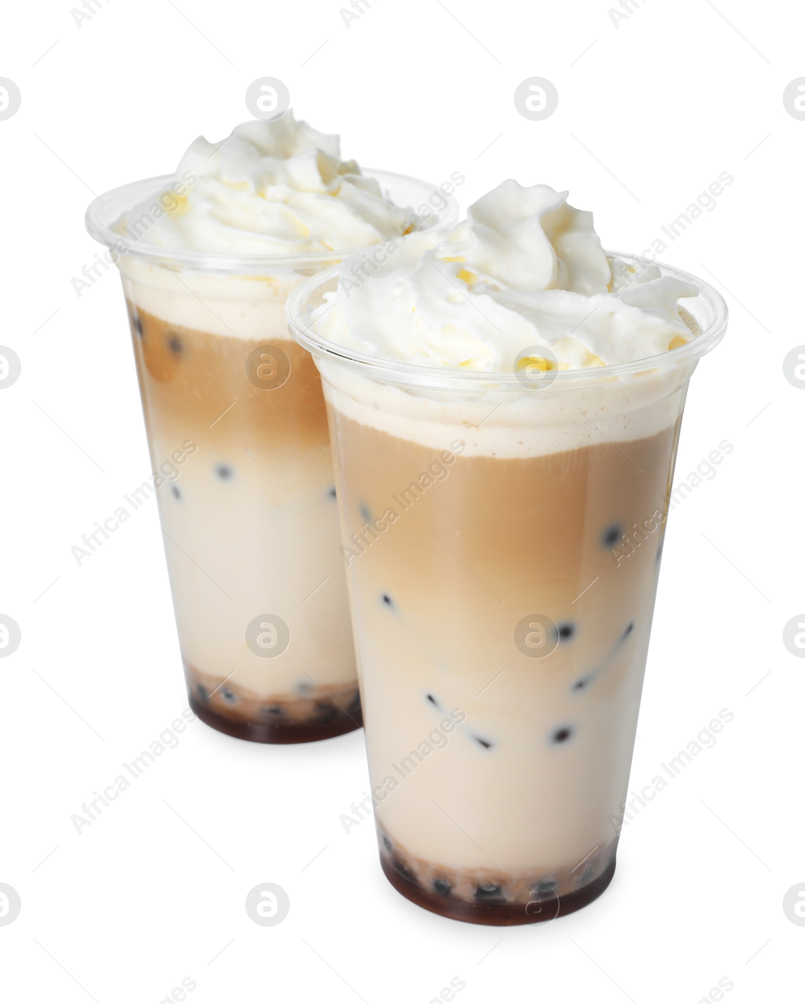 Tasty milk bubble tea in plastic cups isolated on white Photo of Tasty milk bubble tea in plastic cups isolated on white