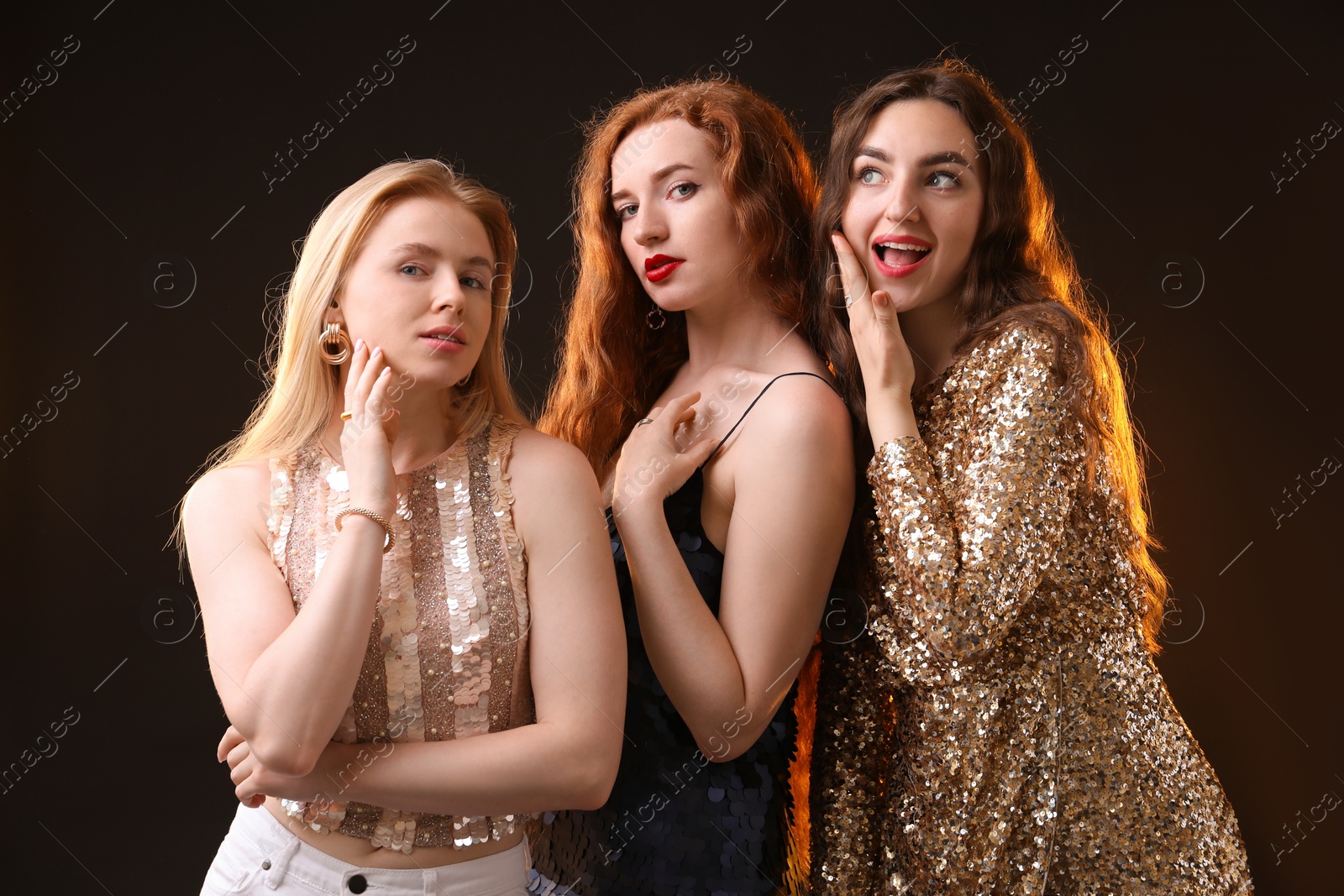 Photo of Beautiful women with different hair colors on dark background