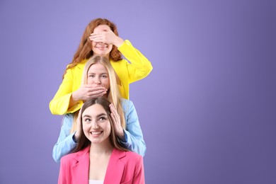 Photo of Beautiful women with different hair colors having fun on purple background, space for text