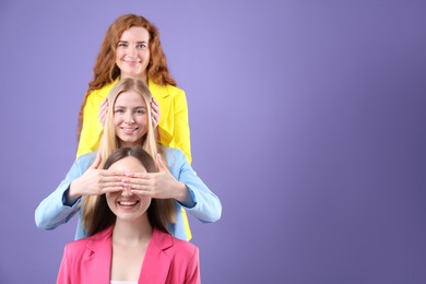 Photo of Beautiful women with different hair colors having fun on purple background, space for text