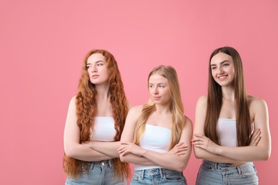 Photo of Beautiful women with different hair colors on pink background