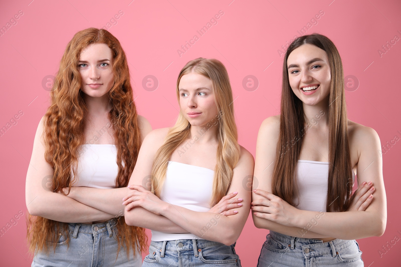Beautiful women with different hair colors on pink background Photo of Beautiful women with different hair colors on pink background
