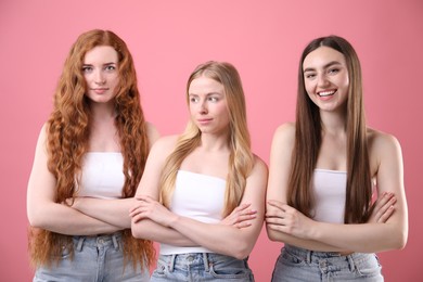 Photo of Beautiful women with different hair colors on pink background
