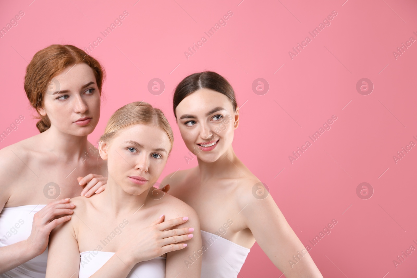 Beautiful women with different hair colors on pink background, space for text Photo of Beautiful women with different hair colors on pink background, space for text