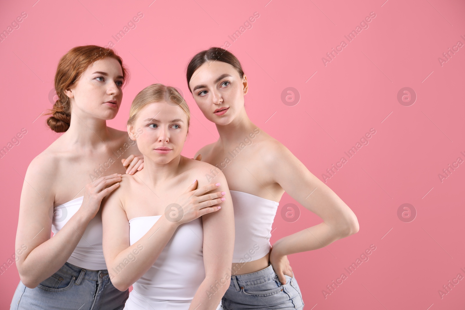 Photo of Beautiful women with different hair colors on pink background, space for text