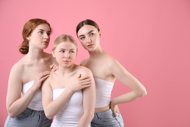Photo of Beautiful women with different hair colors on pink background, space for text