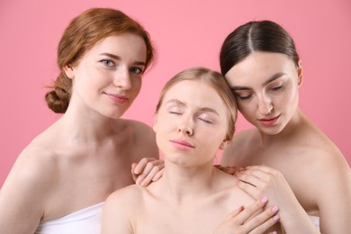 Photo of Beautiful women with different hair colors on pink background
