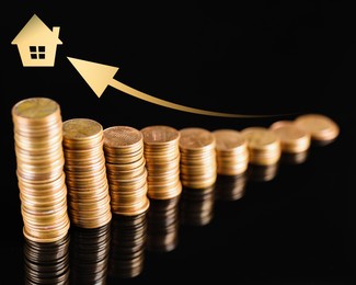 Image of Increase in real estate value. Stacked coins, house icon and arrow on black background