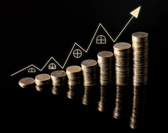 Image of Increase in real estate value. Stacked coins and arrow in shape of house roofs on black background