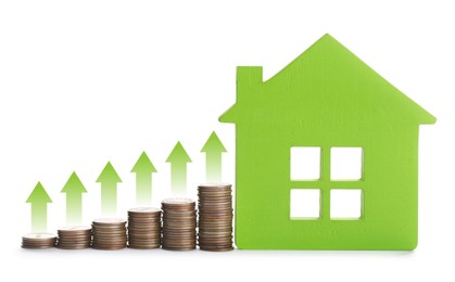 Image of Increase in real estate value. House model and coins on white background. Growing price represented by arrows