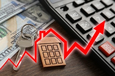 Image of Increase in real estate value. House key, money and calculator on table. Growing price represented by arrow
