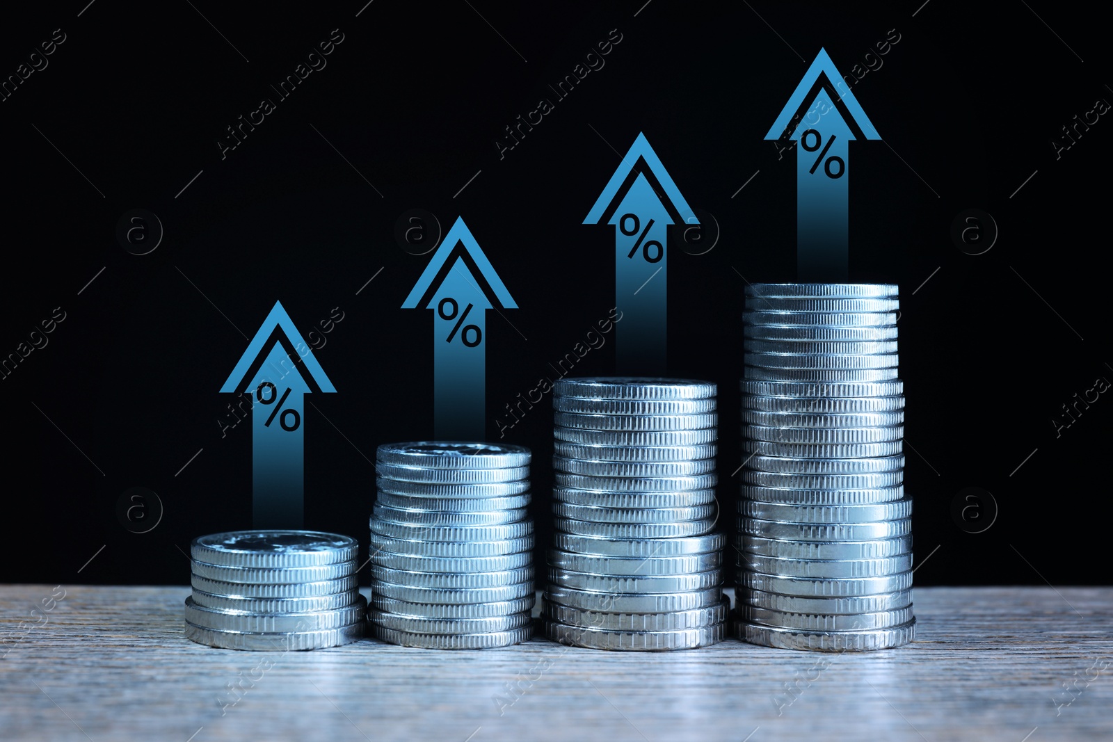 Image of Increase in real estate value. Stacked coins on table. Growing price represented by arrows and percent signs