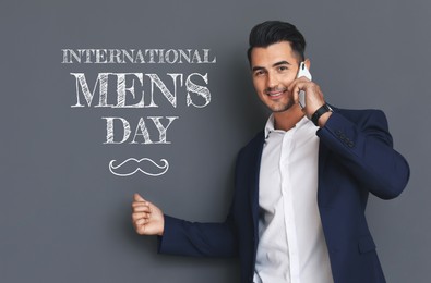 Image of International Men's Day card with moustache illustration. Happy man talking on phone against grey background