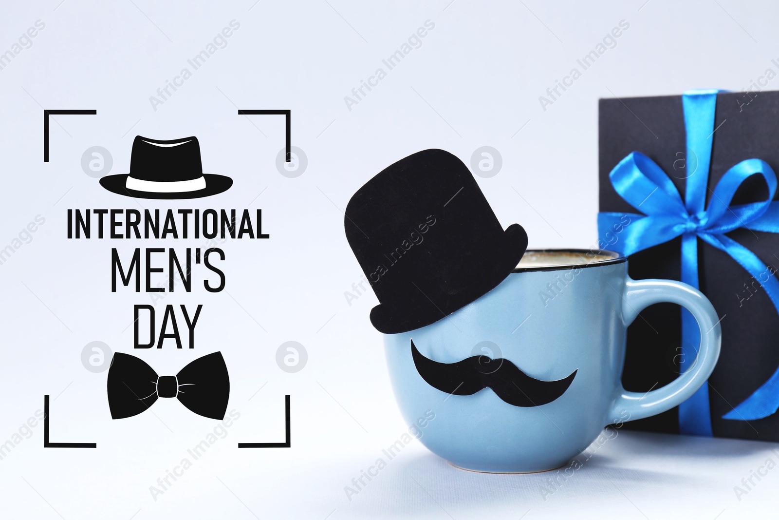 International Men's Day card. Cup with paper hat and moustache and gift box on white background Image of International Men's Day card. Cup with paper hat and moustache and gift box on white background