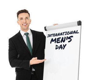 Image of International Men's Day card. Happy man pointing at board against white background