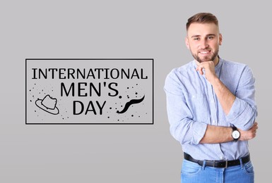 Image of International Men's Day card with hat and moustache illustrations. Happy man on grey background
