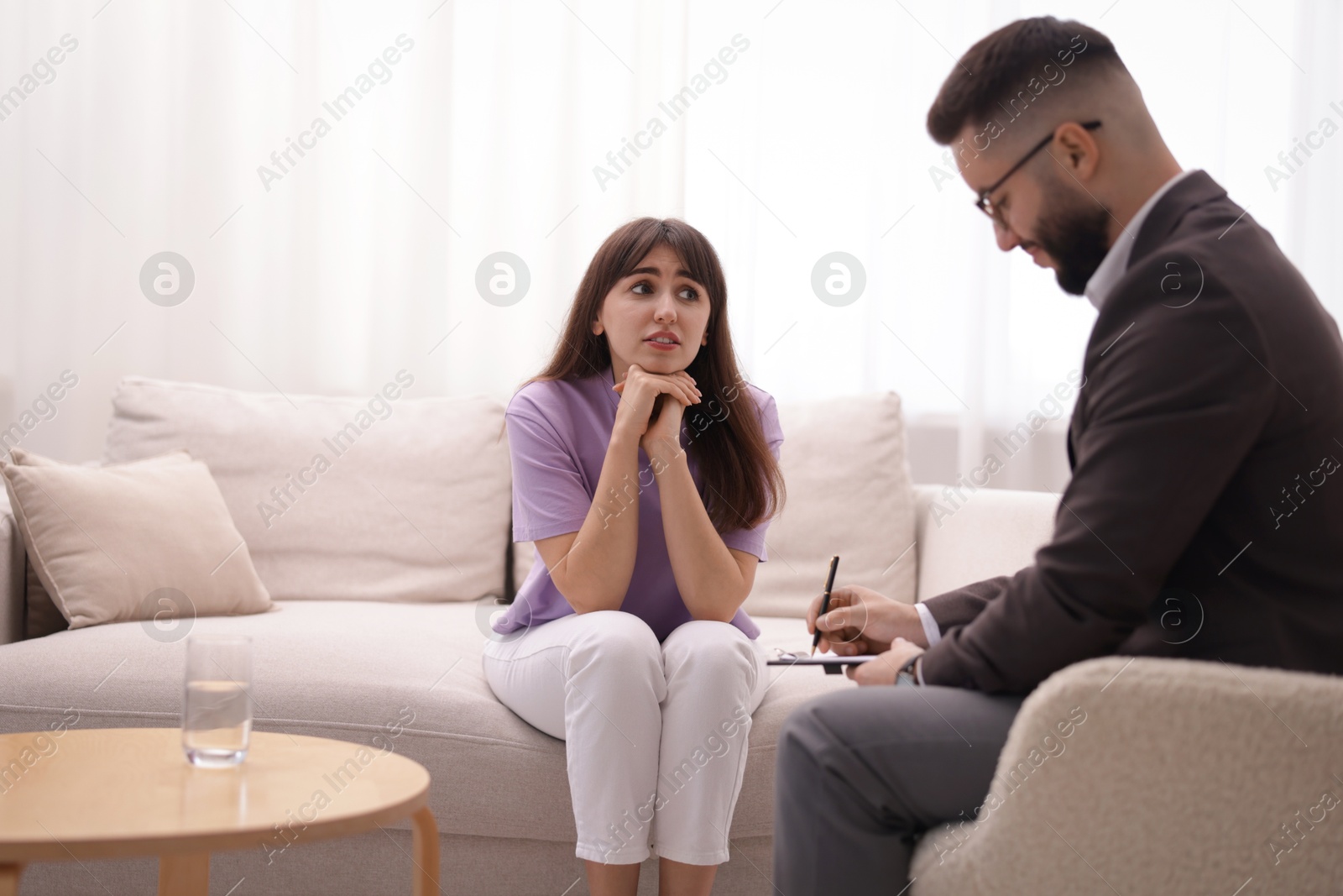 Professional psychologist working with patient in office Photo of Professional psychologist working with patient in office