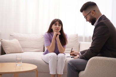 Photo of Professional psychologist working with patient in office